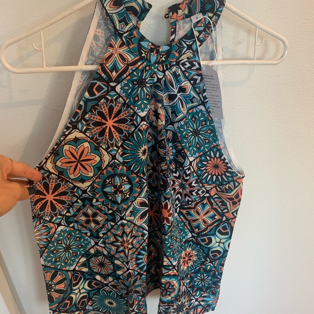 Multi-colored sleeveless top. Brand new.